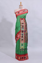 Green plain art tussar saree with contrast ikkat style border and floral design striped pallu