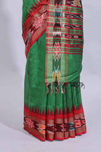 Green plain art tussar saree with contrast ikkat style border and floral design striped pallu
