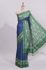 Blue geometric motifs design art tussar saree with contrast floral design border and printed blouse