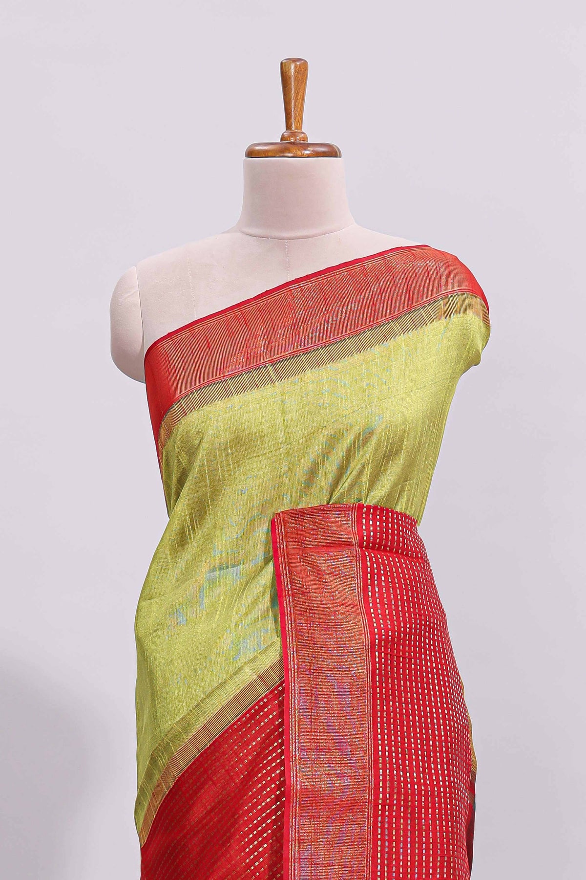 Green plain design art tussar saree with contrast striped border and blouse