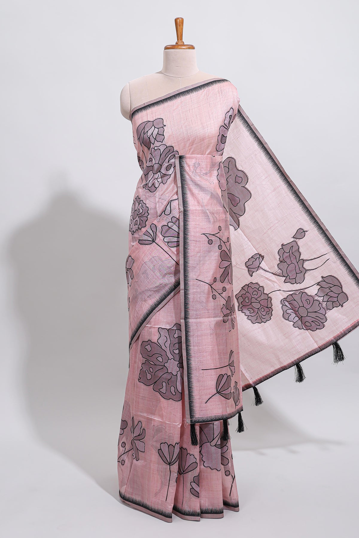Blush pink with charcoal grey floral print tussar saree with self sleek serrated border and matching blouse