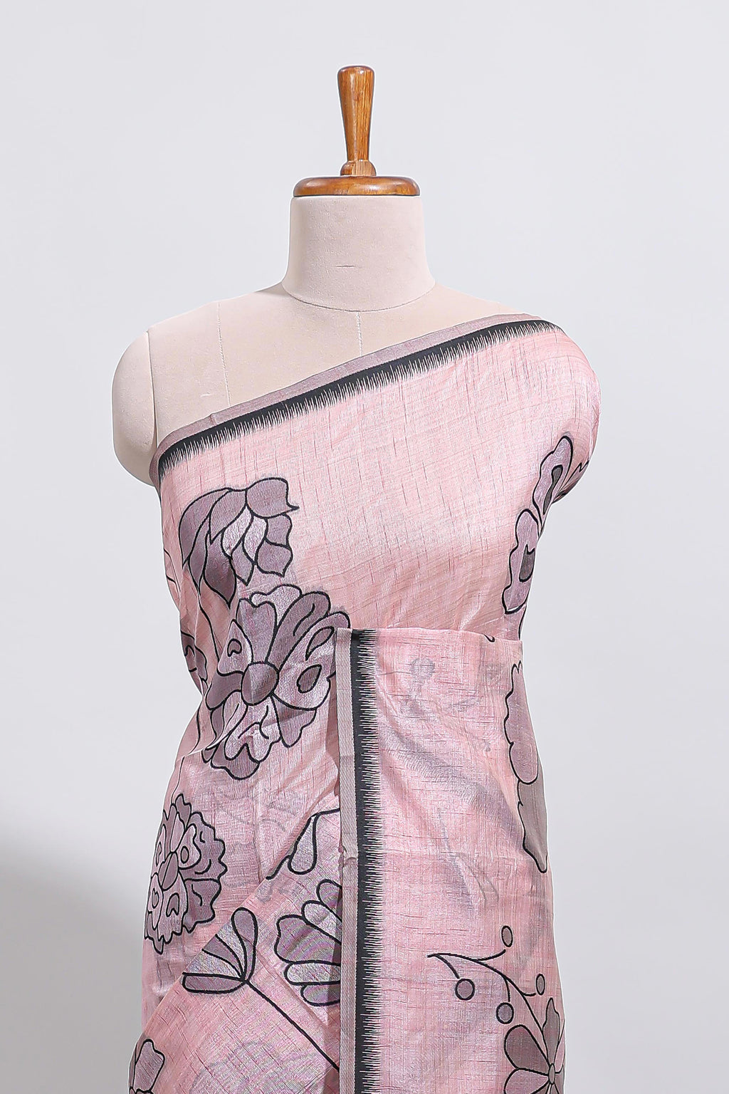 Blush pink with charcoal grey floral print tussar saree with self sleek serrated border and matching blouse