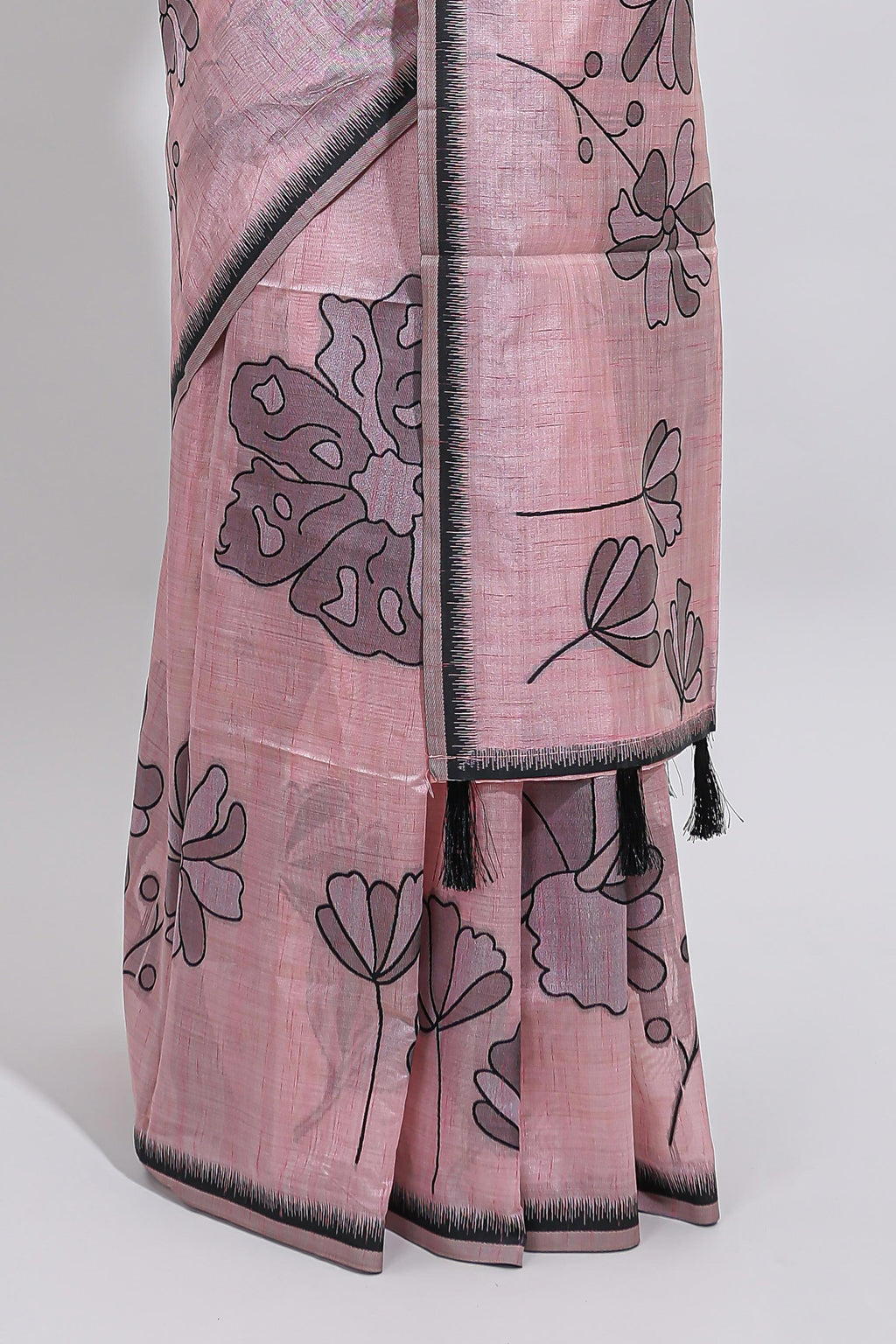 Blush pink with charcoal grey floral print tussar saree with self sleek serrated border and matching blouse