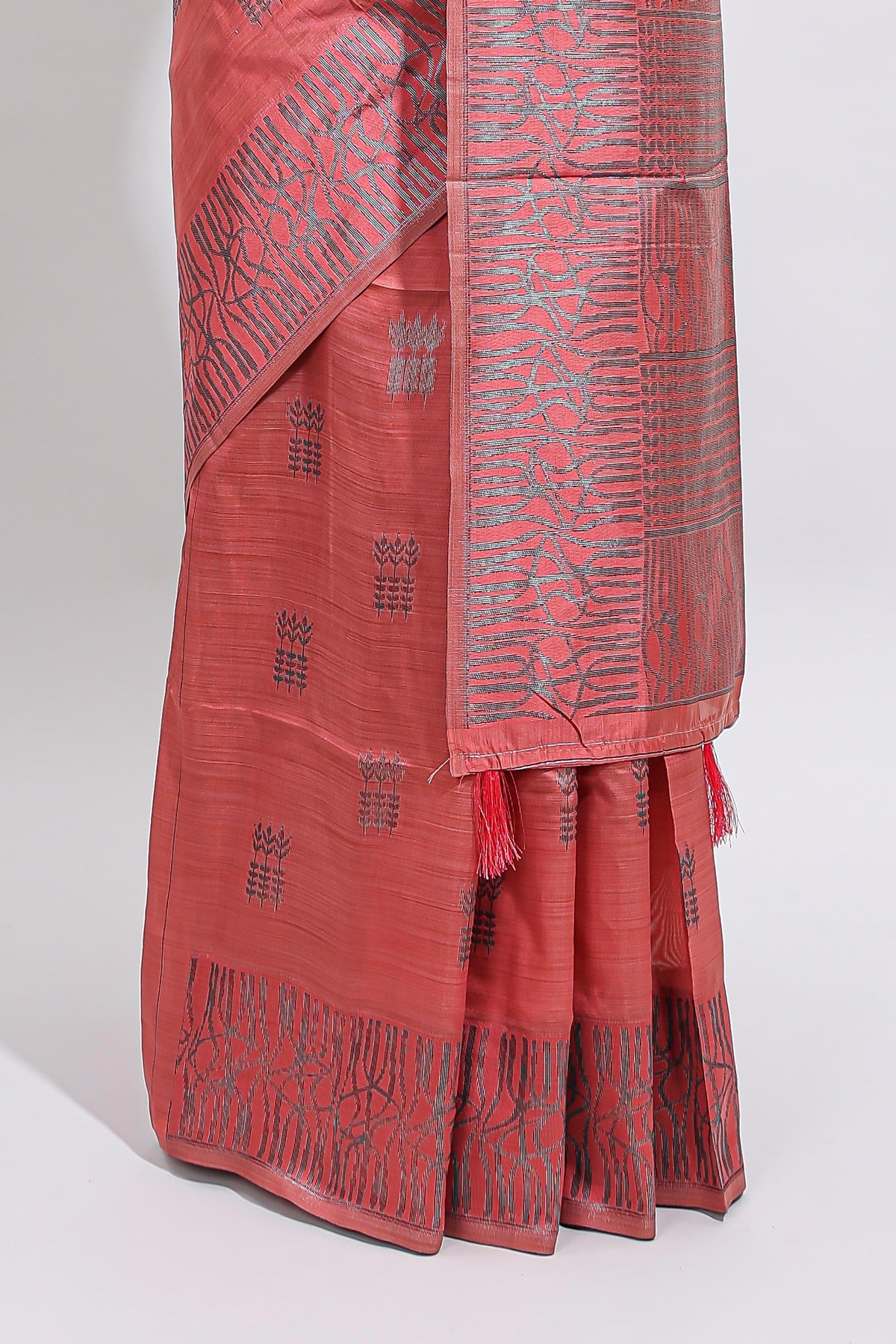 Coral rust geometric matrix tussar saree with self tangled branchesborder and pallu with matching blouse