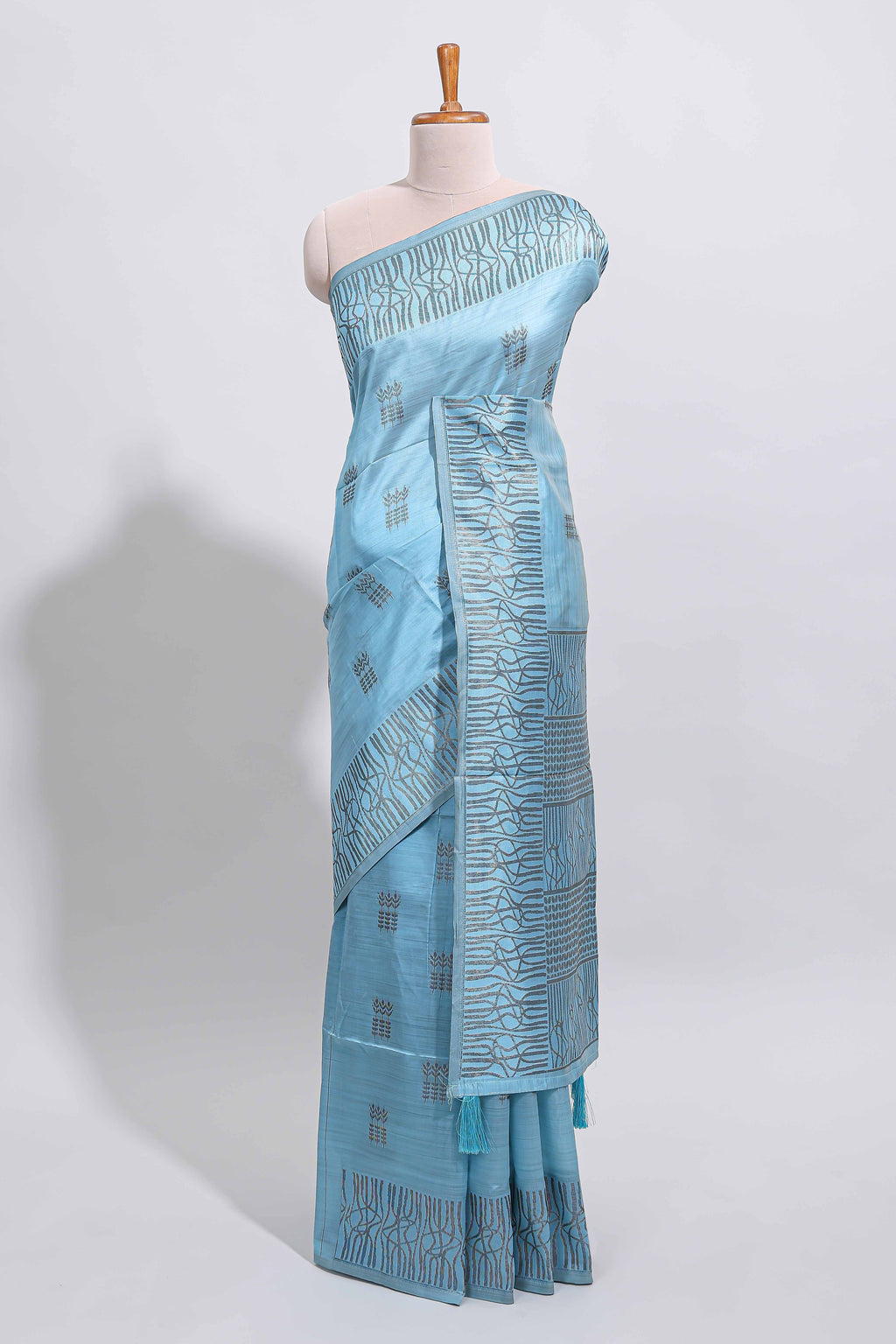 Light blue geometric matrix tussar saree with self tangled branchesborder and pallu with matching blouse