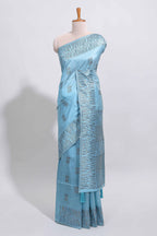 Light blue geometric matrix tussar saree with self tangled branchesborder and pallu with matching blouse