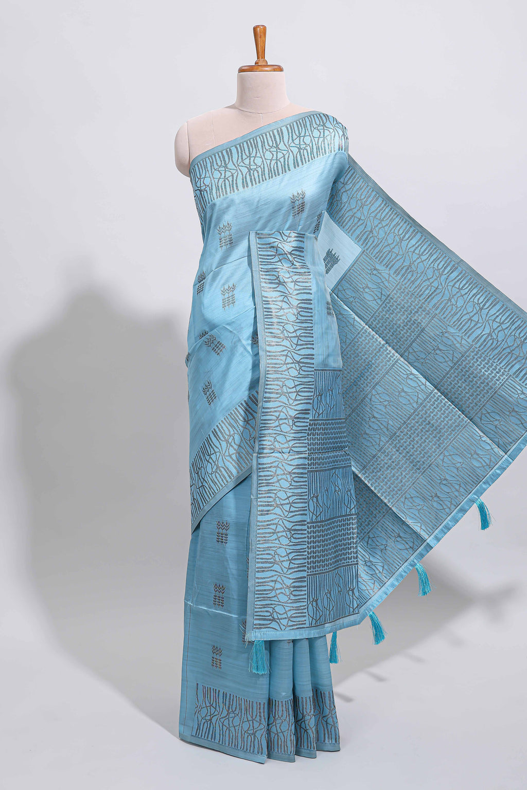 Light blue geometric matrix tussar saree with self tangled branchesborder and pallu with matching blouse