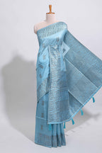 Light blue geometric matrix tussar saree with self tangled branchesborder and pallu with matching blouse