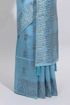 Light blue geometric matrix tussar saree with self tangled branchesborder and pallu with matching blouse