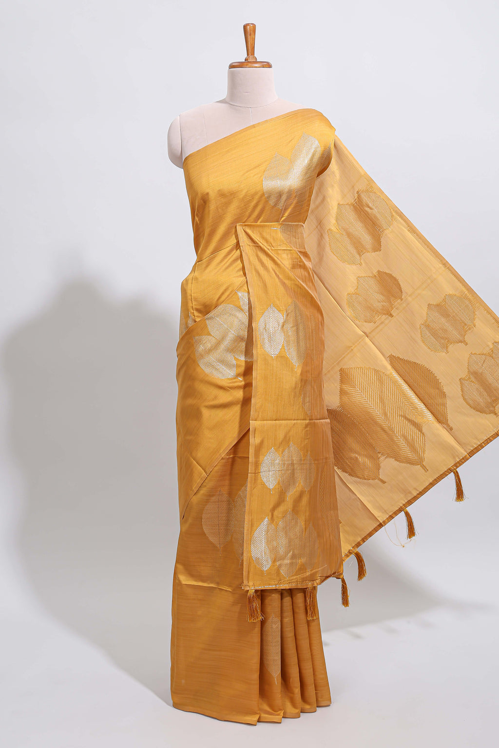 Borderless mustard yellow monochrome leafy motifs tussar saree with matching blouse