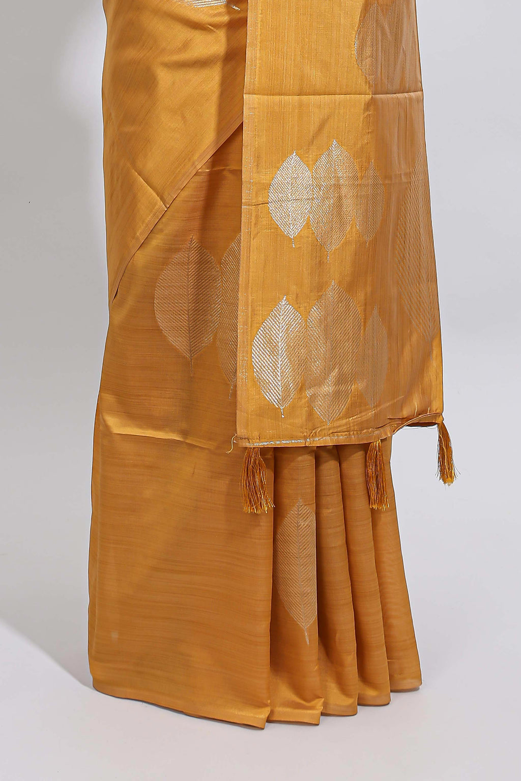 Borderless mustard yellow monochrome leafy motifs tussar saree with matching blouse