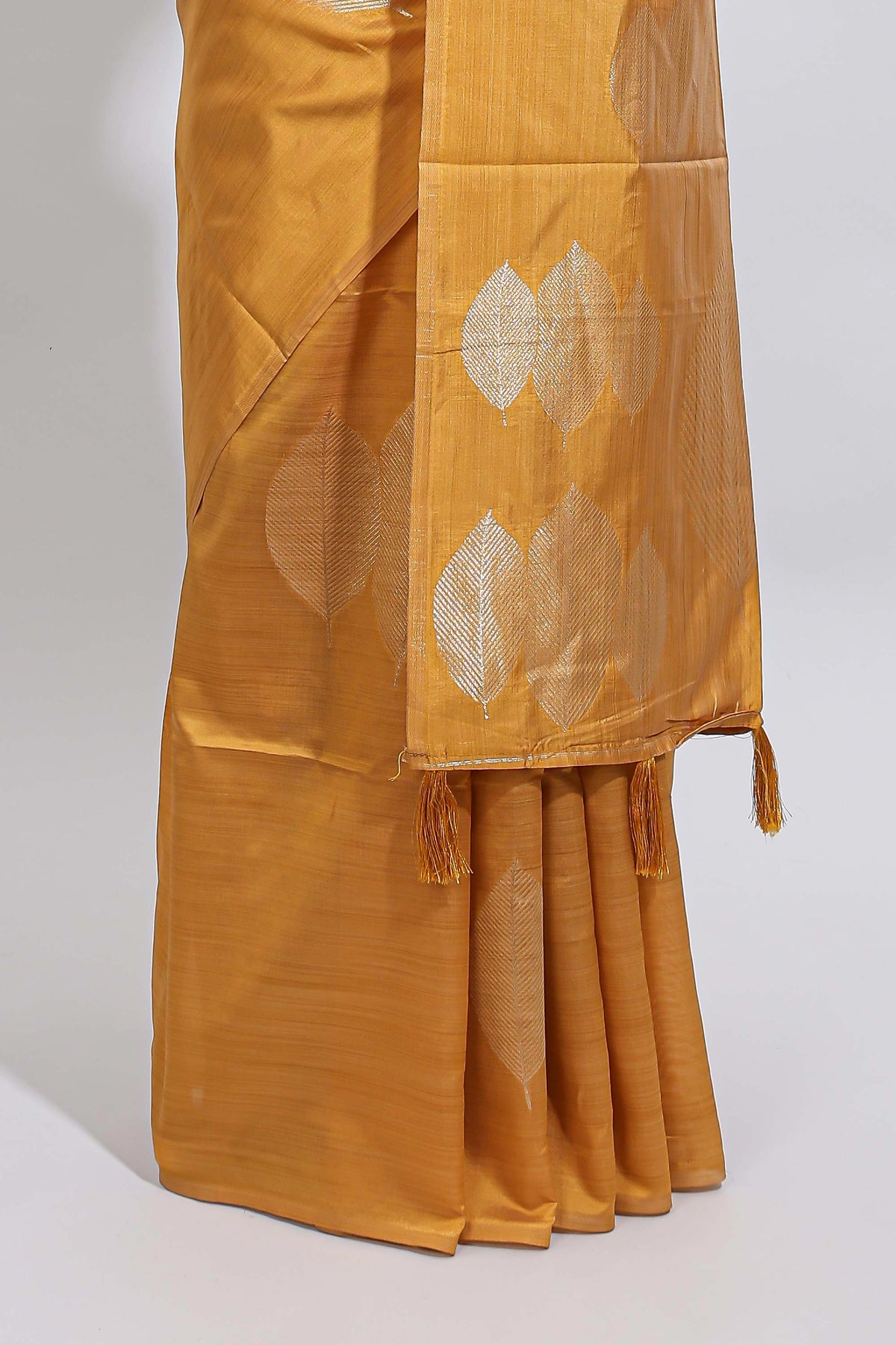 Borderless mustard yellow monochrome leafy motifs tussar saree with matching blouse