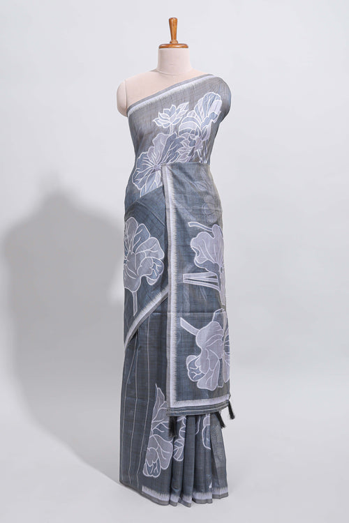 Charcoal grey with white floral print tussar saree with self sleek serrated border and matching blouse