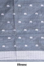 Charcoal grey with white floral print tussar saree with self sleek serrated border and matching blouse