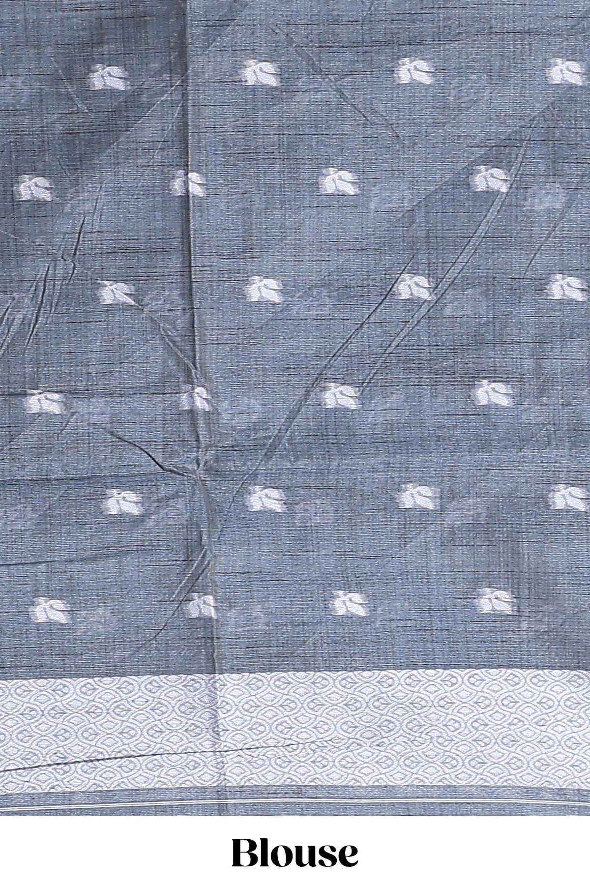 Charcoal grey with white floral print tussar saree with self sleek serrated border and matching blouse