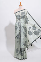 Sage green with charcoal grey floral print tussar saree with self sleek serrated border and matching blouse