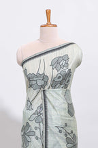 Sage green with charcoal grey floral print tussar saree with self sleek serrated border and matching blouse