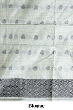 Sage green with charcoal grey floral print tussar saree with self sleek serrated border and matching blouse