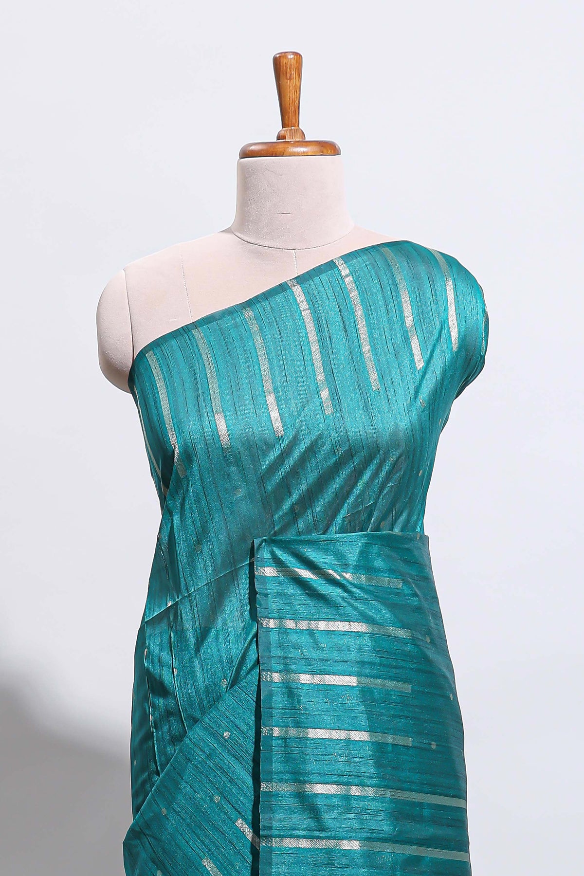 Borderless teal-peacock blue vertical zari striped and polka tussar saree with matching blouse