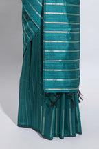 Borderless teal-peacock blue vertical zari striped and polka tussar saree with matching blouse