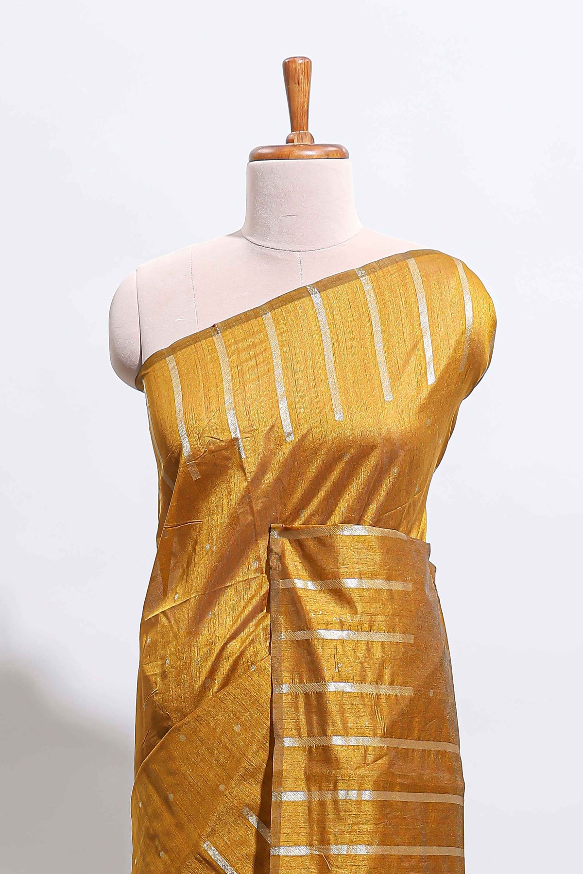 Borderless mustard gold vertical zari striped and polka tussar saree with matching blouse