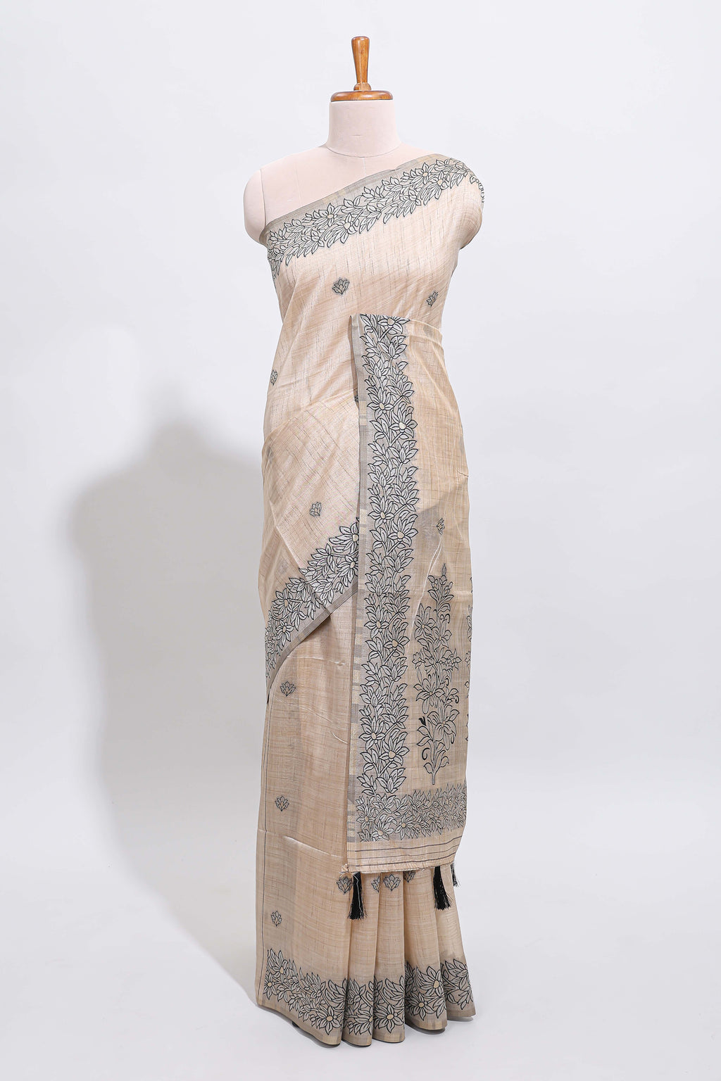 Off white floral motifs tussar saree with self floral designed border and matching blouse