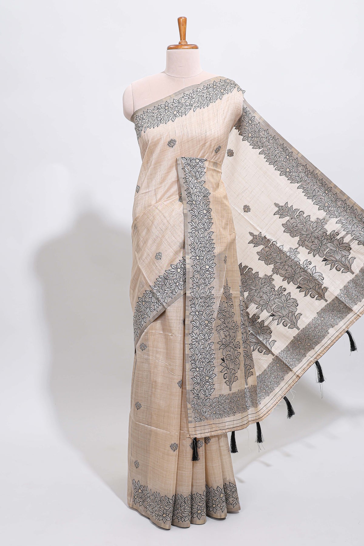 Off white floral motifs tussar saree with self floral designed border and matching blouse
