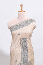 Off white floral motifs tussar saree with self floral designed border and matching blouse