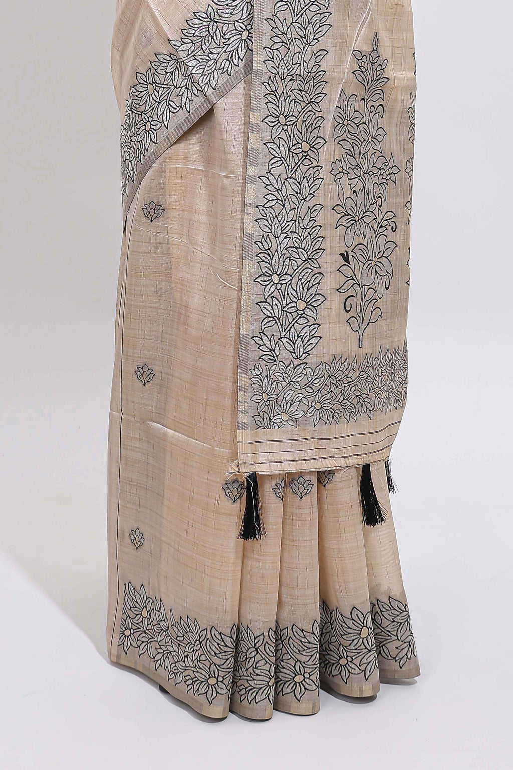 Off white floral motifs tussar saree with self floral designed border and matching blouse