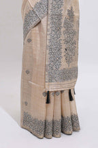 Off white floral motifs tussar saree with self floral designed border and matching blouse