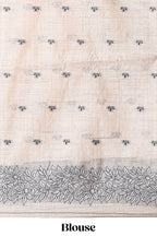 Off white floral motifs tussar saree with self floral designed border and matching blouse