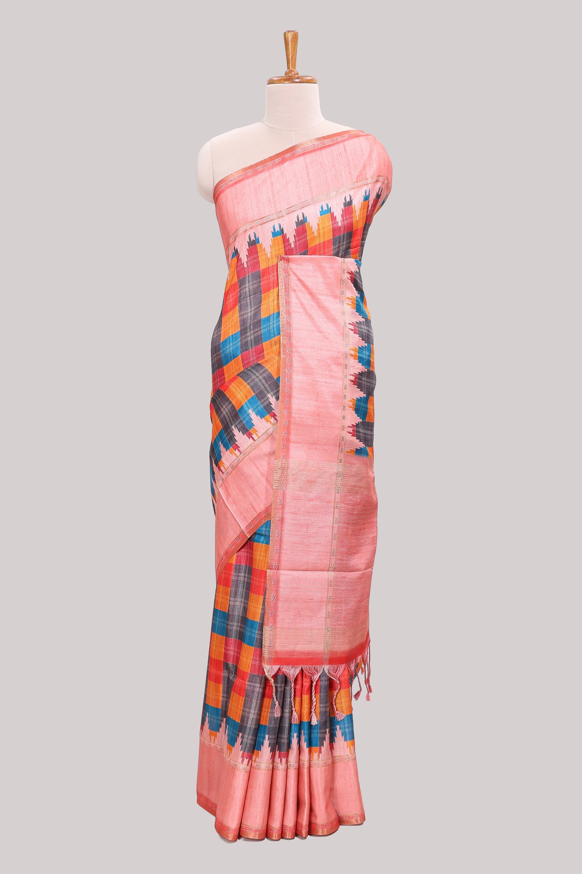 Multicolor checked tussar saree with peach contrast border and pallu that comes with matching blouse