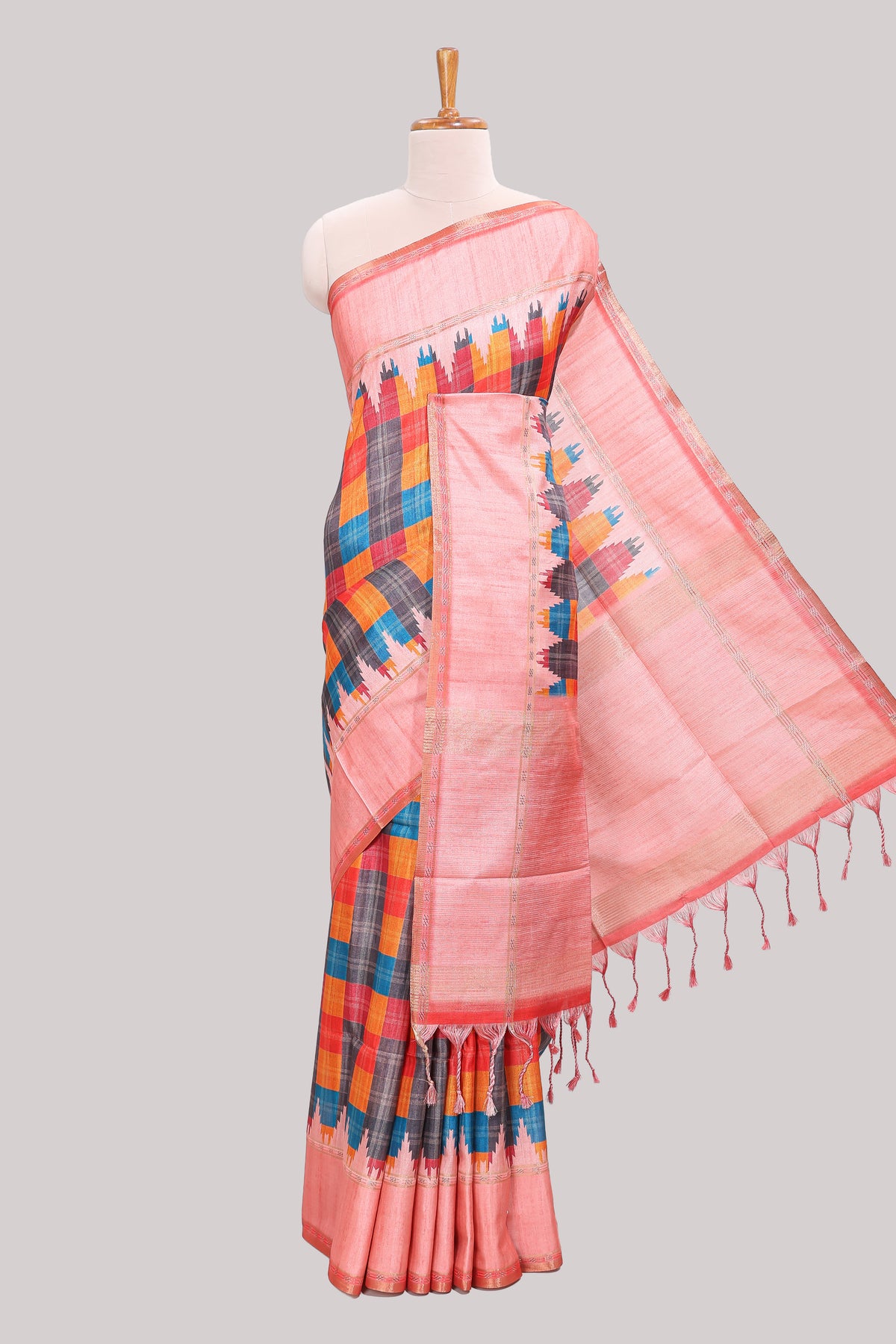 Multicolor checked tussar saree with peach contrast border and pallu that comes with matching blouse