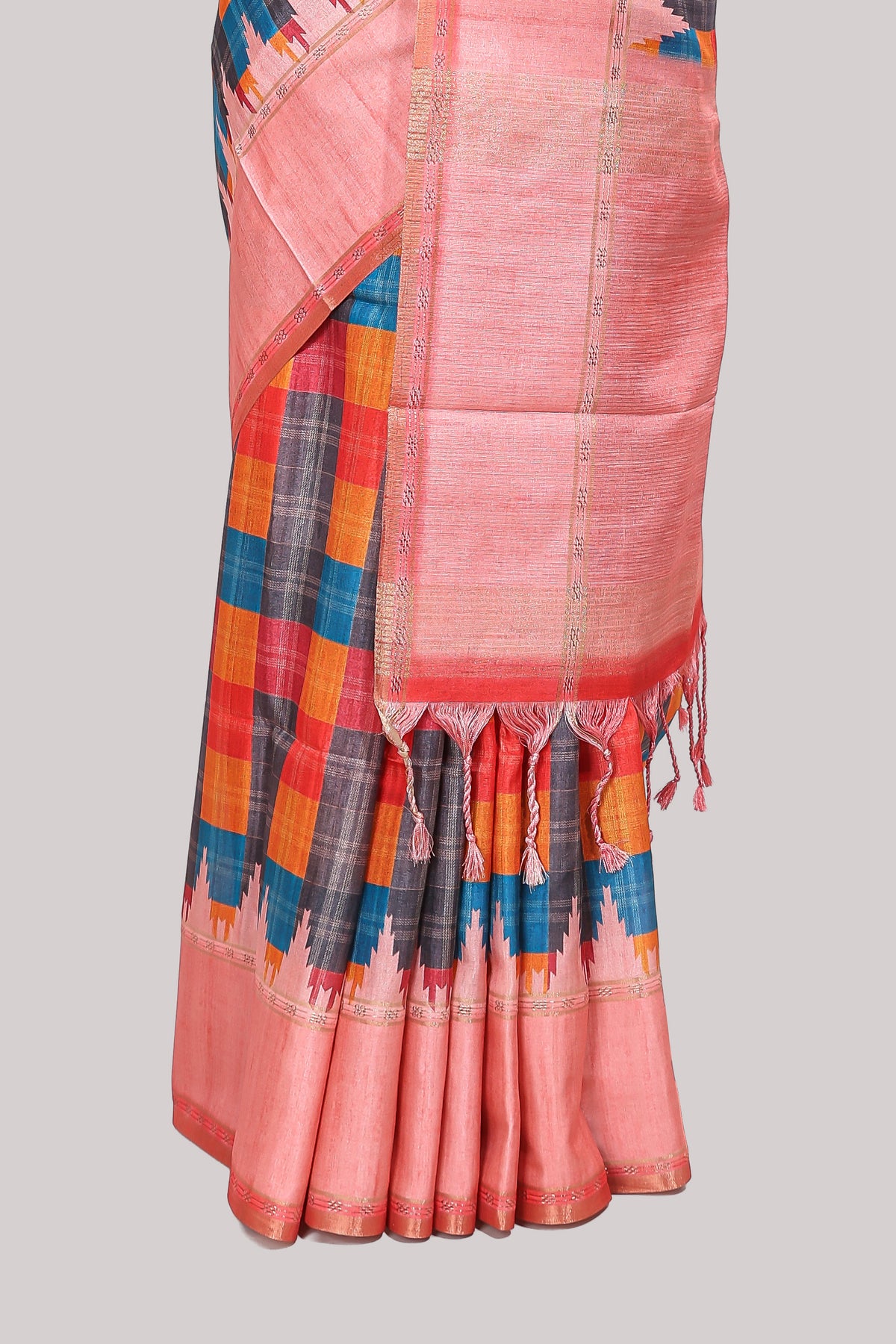 Multicolor checked tussar saree with peach contrast border and pallu that comes with matching blouse
