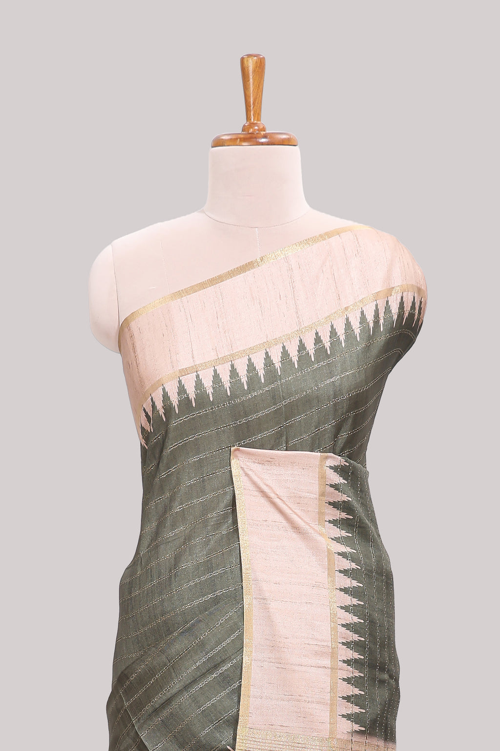 Moss green striped tussar saree with contrast border and pallu that comes with blouse
