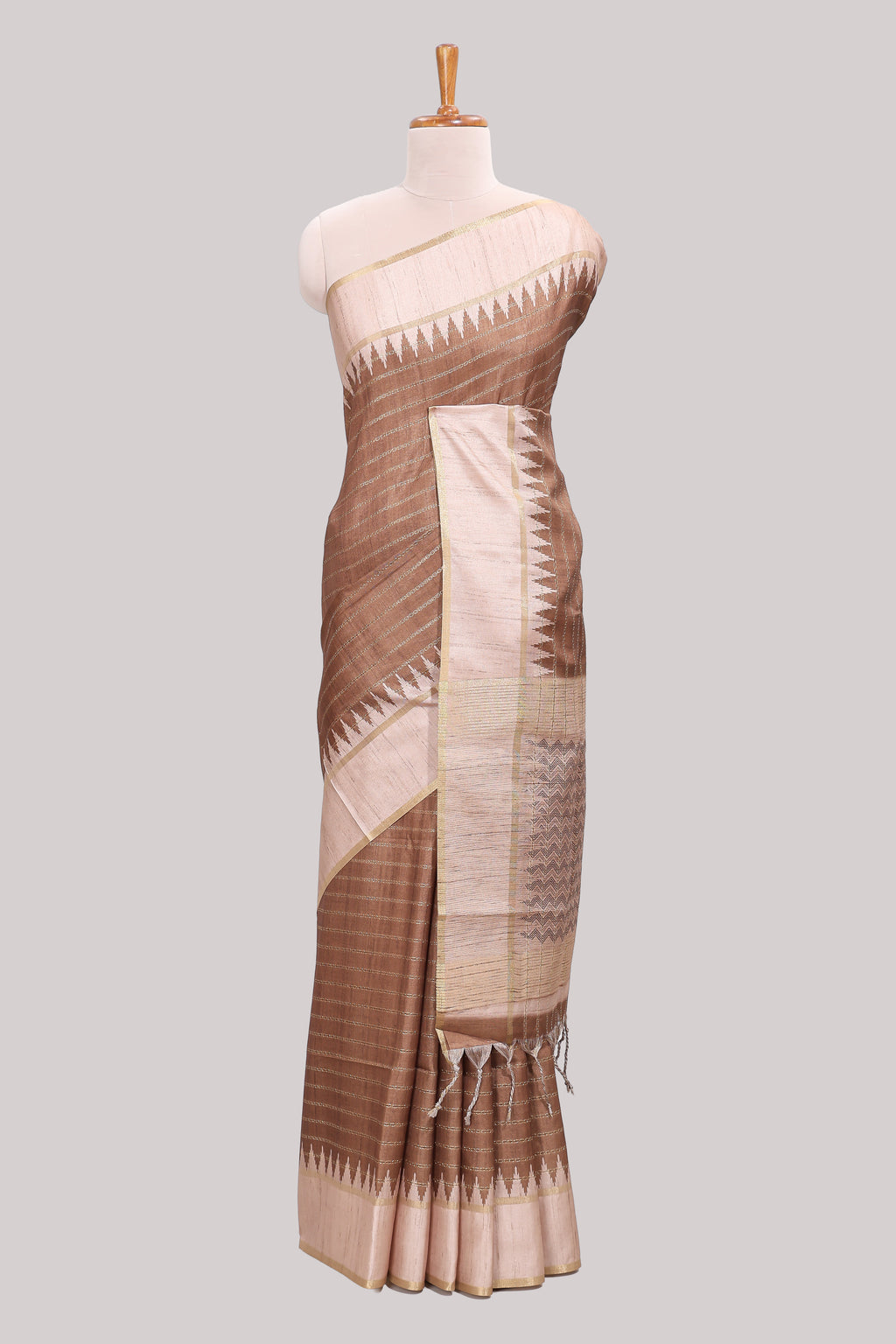 Brown striped tussar saree with contrast border and pallu that comes with blouse