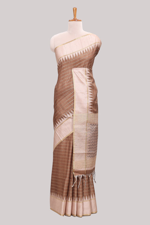 Brown striped tussar saree with contrast border and pallu that comes with blouse