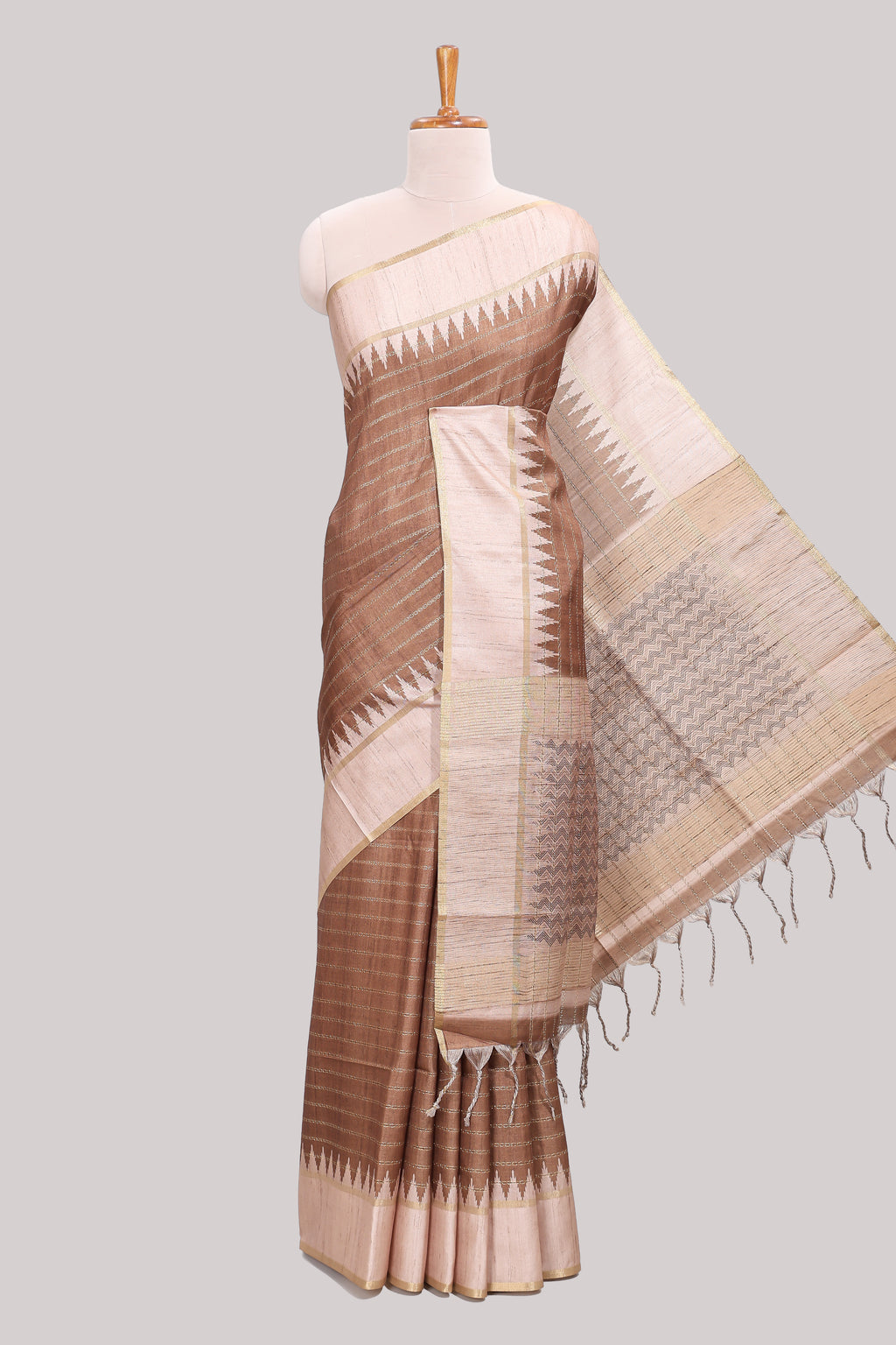 Brown striped tussar saree with contrast border and pallu that comes with blouse