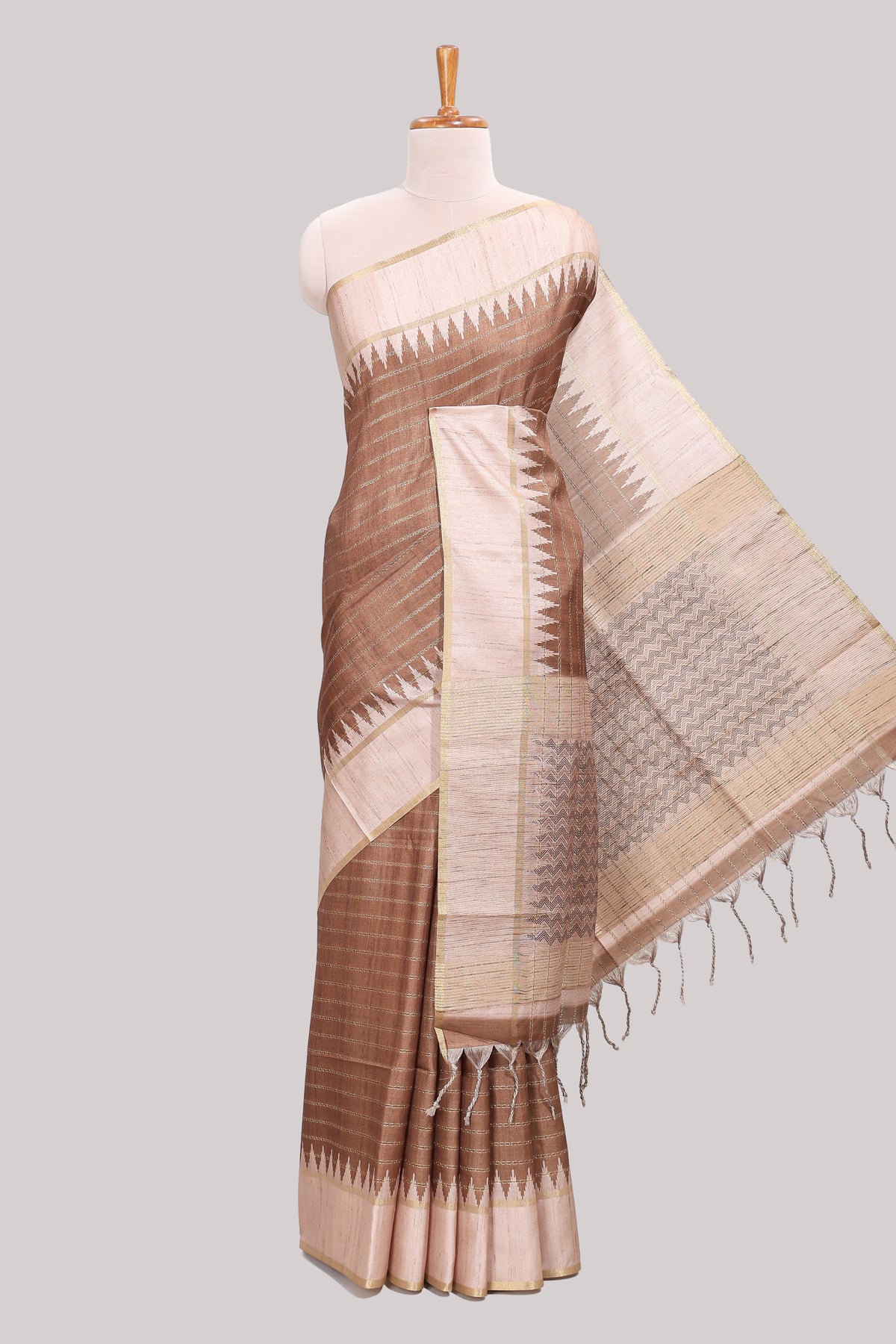 Brown striped tussar saree with contrast border and pallu that comes with blouse