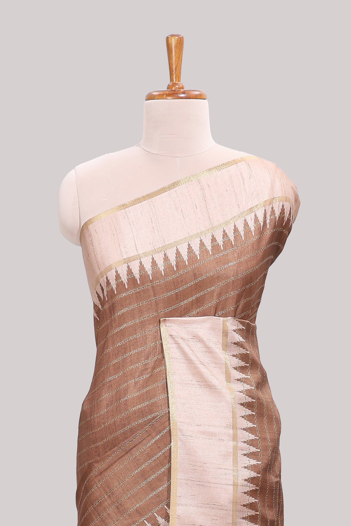 Brown striped tussar saree with contrast border and pallu that comes with blouse