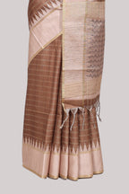 Brown striped tussar saree with contrast border and pallu that comes with blouse