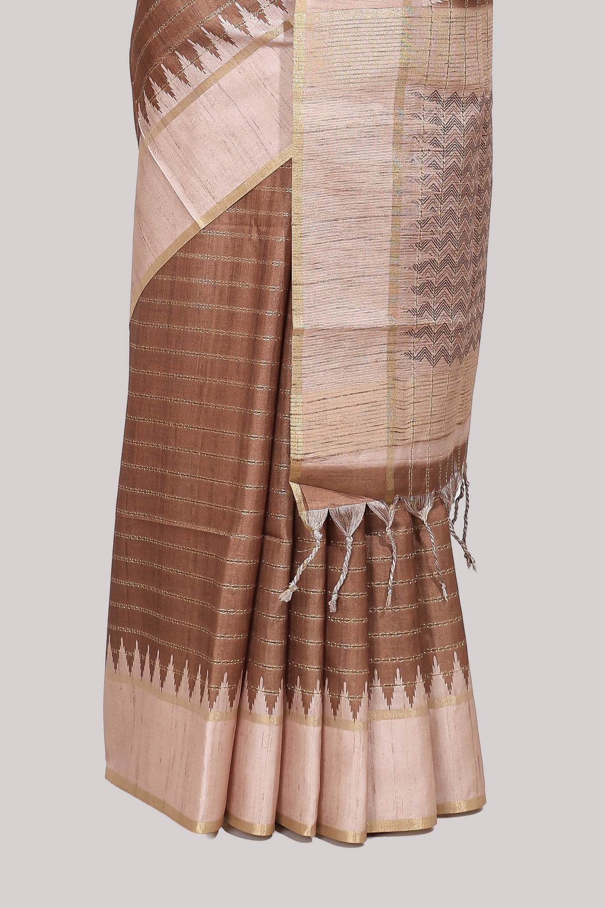 Brown striped tussar saree with contrast border and pallu that comes with blouse