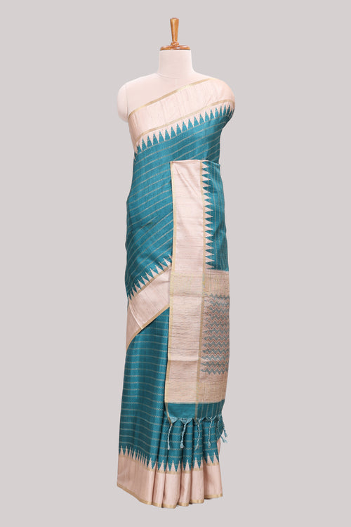 Teal green striped tussar saree with contrast border and pallu that comes with blouse