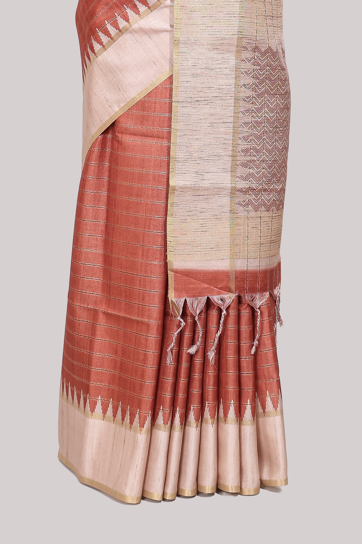 Rust striped tussar saree with contrast border and pallu that comes with blouse