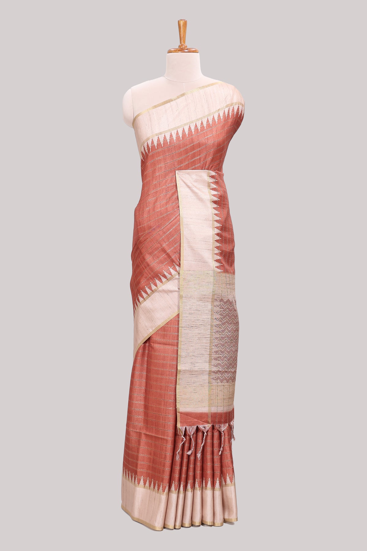 Rust striped tussar saree with contrast border and pallu that comes with blouse