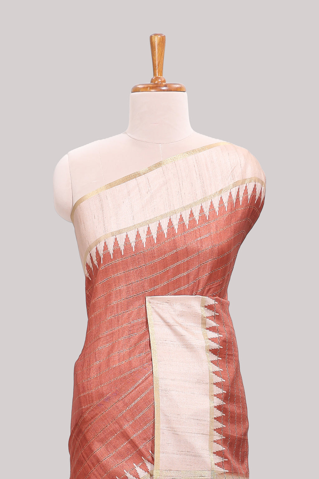 Rust striped tussar saree with contrast border and pallu that comes with blouse