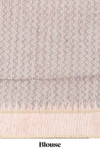 Grey striped tussar saree with contrast border and pallu that comes with blouse