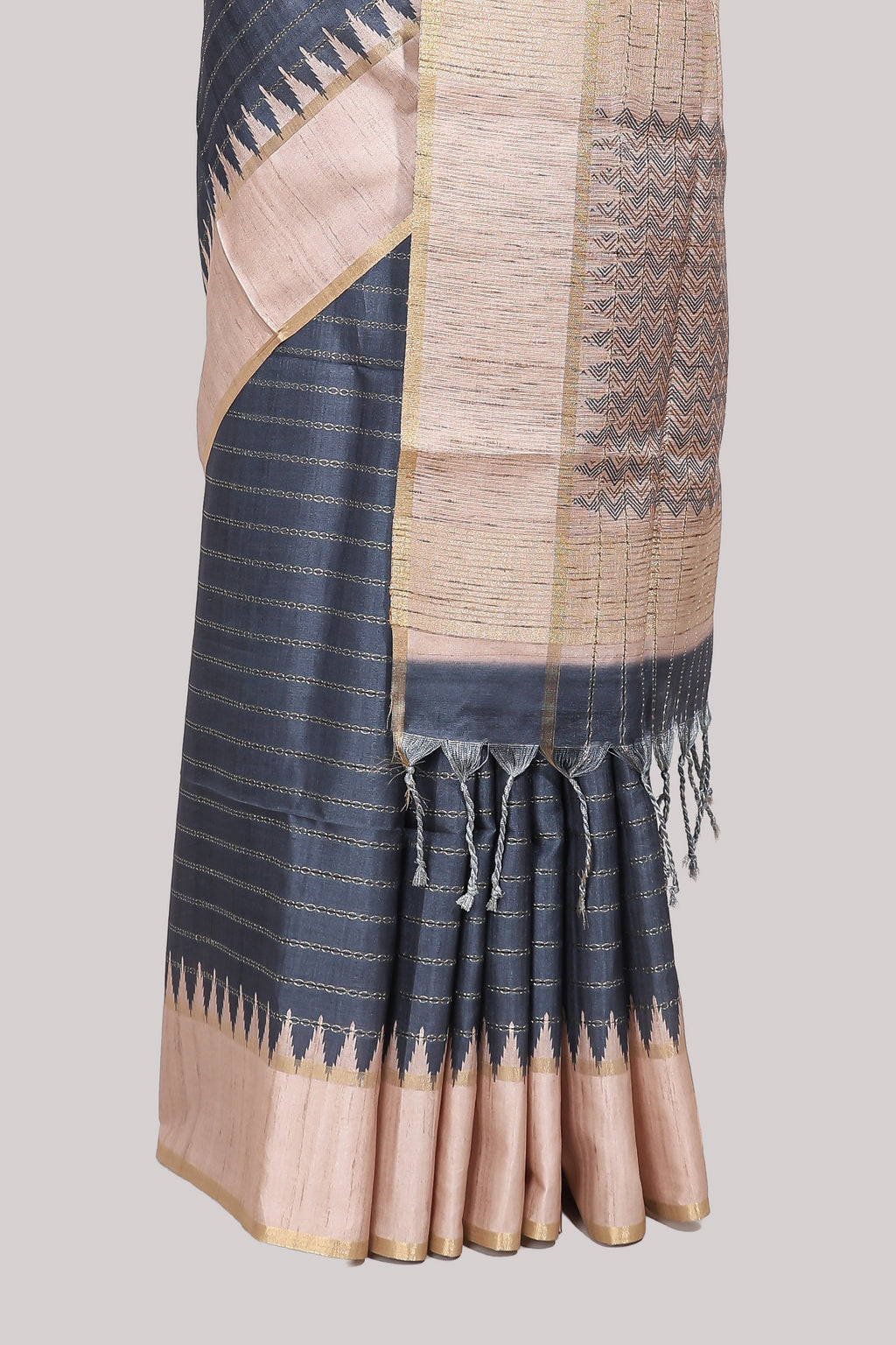 Grey striped tussar saree with contrast border and pallu that comes with blouse
