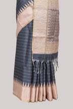 Grey striped tussar saree with contrast border and pallu that comes with blouse