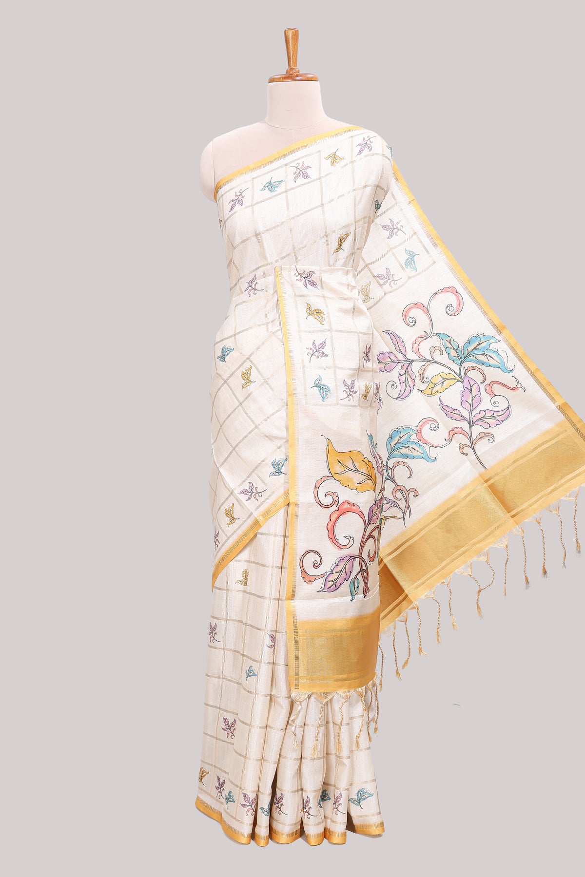 Off white checked tussar saree with contrast border and pallu that comes with matching floral blouse